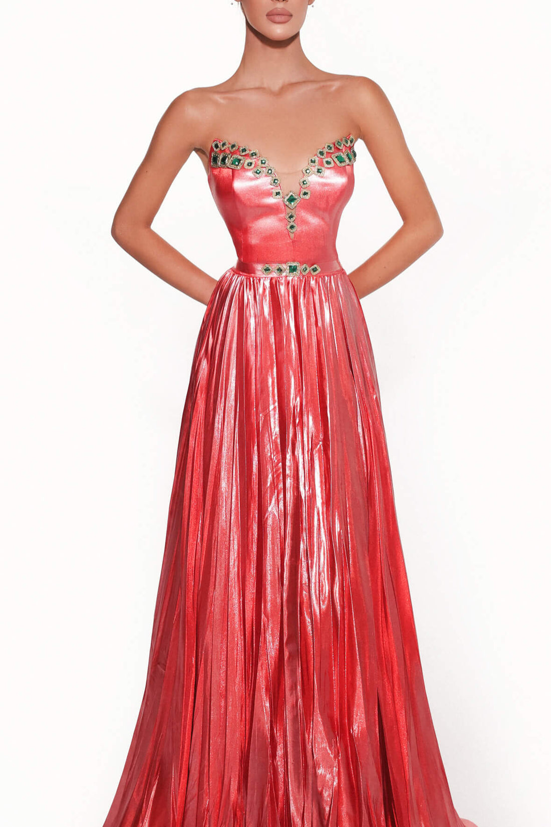 Red evening gown with embellishments on a white background