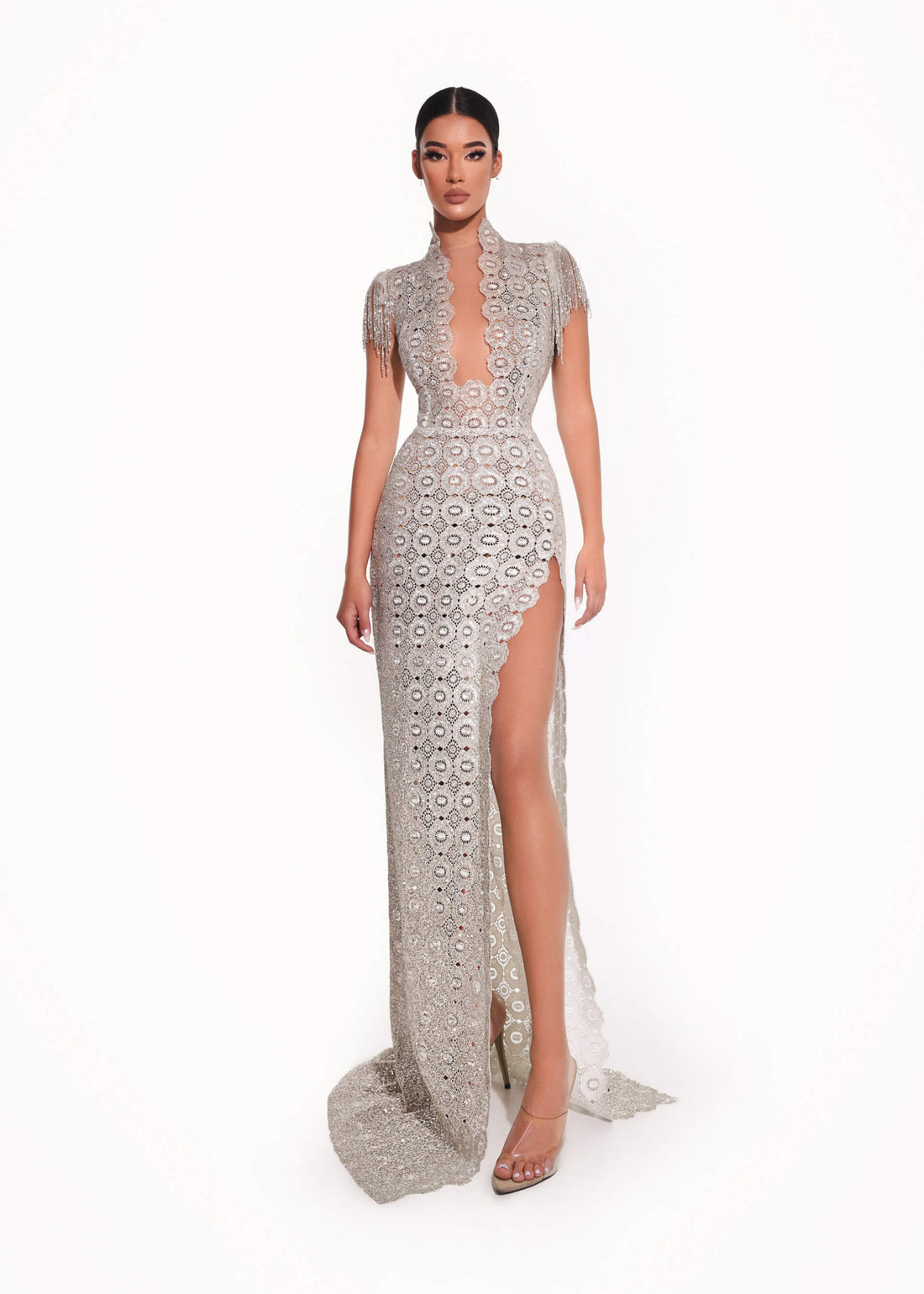 Woman wearing a patterned evening gown on a white background