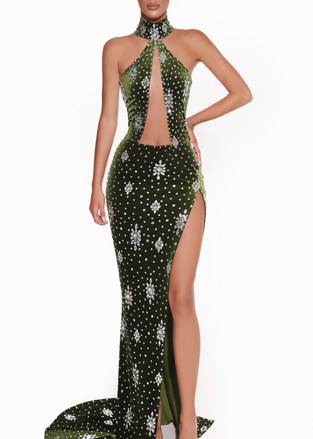Woman wearing a green evening gown with floral patterns on a white background