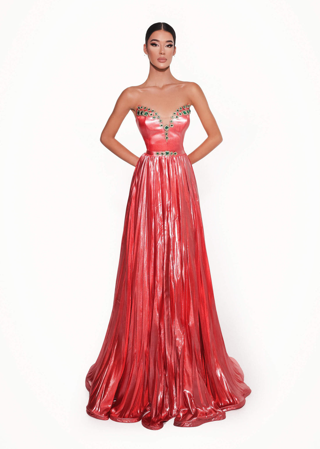 Red evening gown with embellishments on a white background