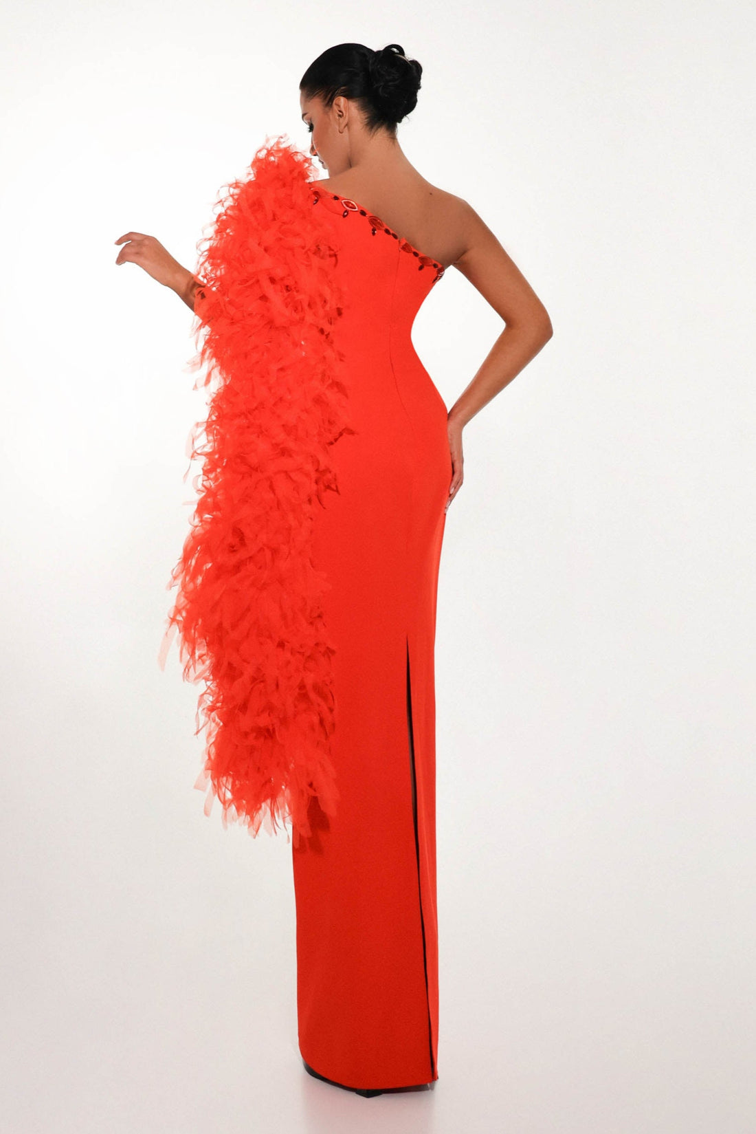 Bold red couture gown side pose 