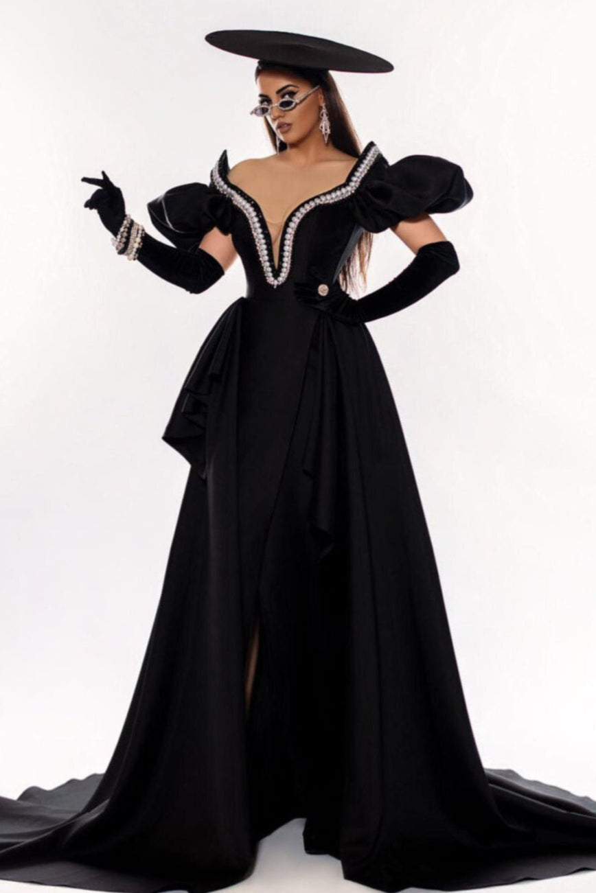 Dramatic Black Gown with Statement Sleeves and Hat