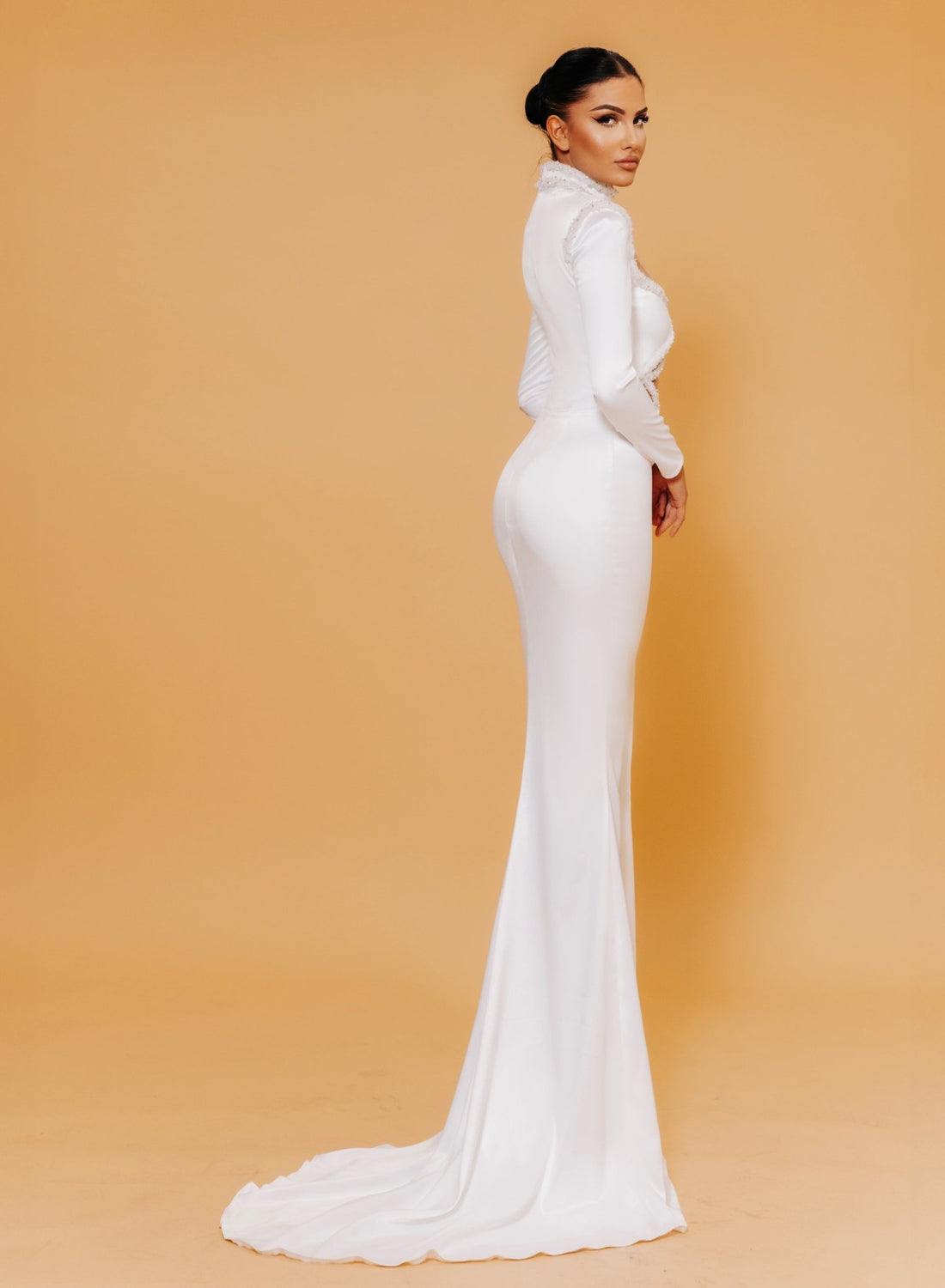 WHITE LONG SLEEVE CUTOUT MERMAID DRESS WITH PEARL EMBELLISHMENTS KUJTA & MERI WHITE LONG SLEEVE CUTOUT MERMAID DRESS WITH PEARL EMBELLISHMENTS KUJTA & MERI